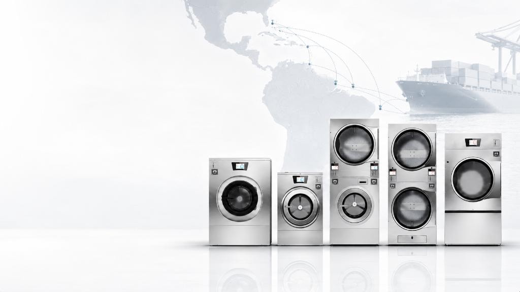 Seacoast Laundry commercial laundry equipment lineup with Caribbean export map